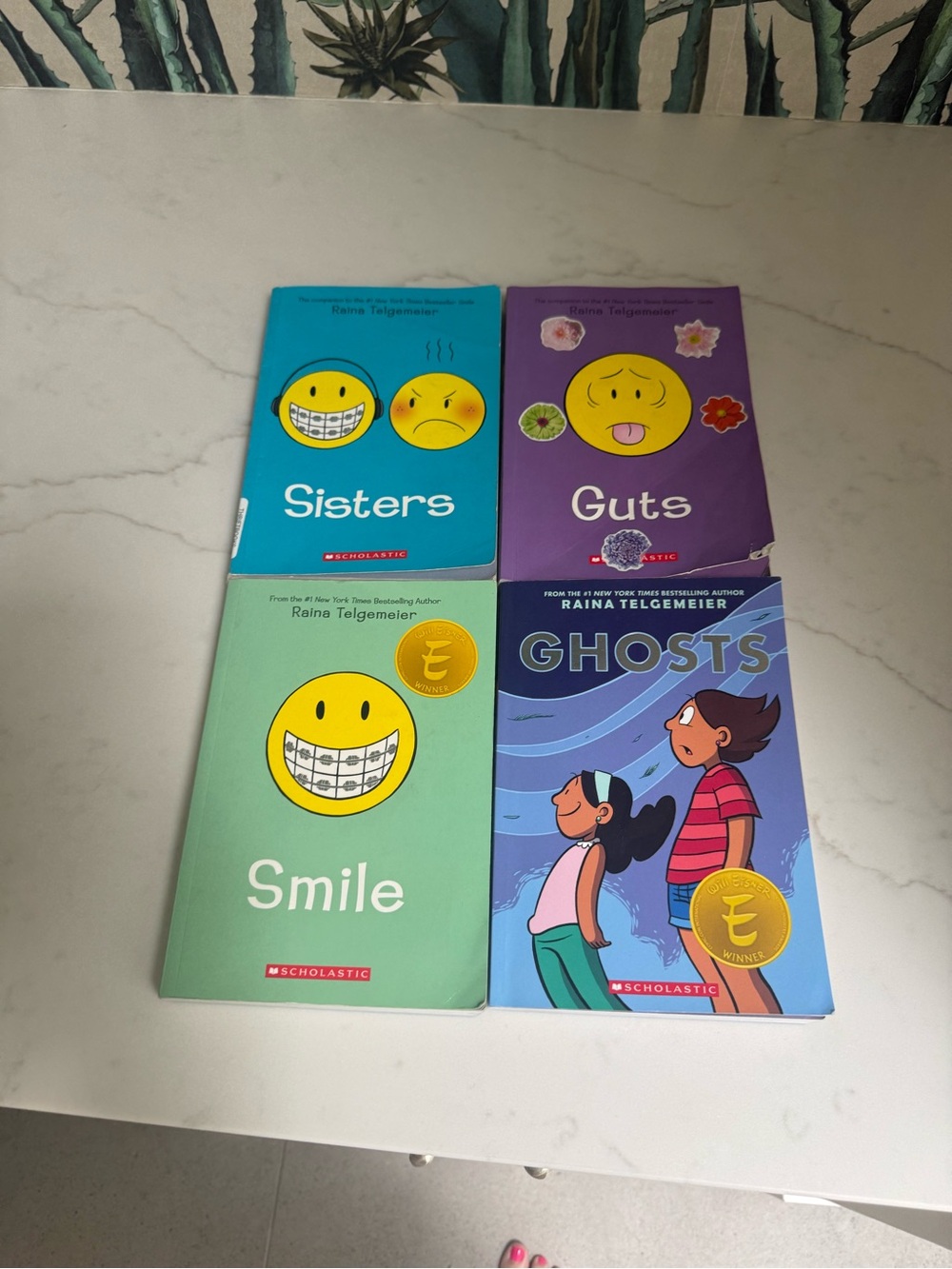 4 books by Raina Telgemeier